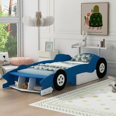 a child's bedroom with a blue race car bed