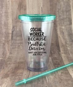 a plastic cup with the words social worker on it and a green straw next to it