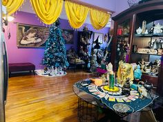 a living room filled with furniture and christmas trees