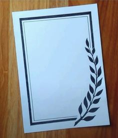 a piece of paper with a laurel design on it