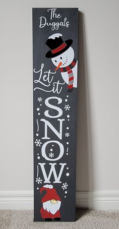 a sign that says let it snow on the wall next to a carpeted floor