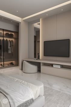 a large white bed sitting in a bedroom next to a tv mounted on a wall