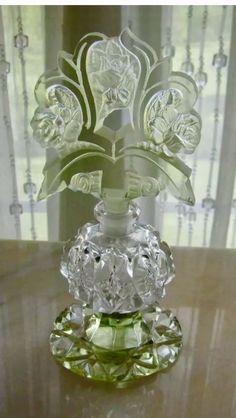 a glass vase sitting on top of a table