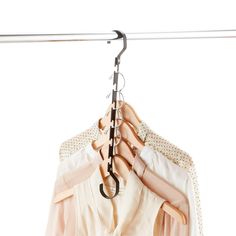 clothes hanging on a rail with an iron hook