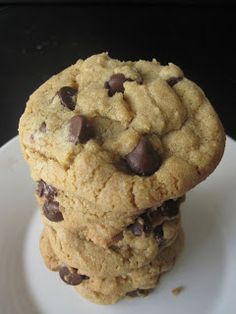 three chocolate chip cookies stacked on top of each other