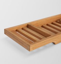 a wooden tray with three compartments on it