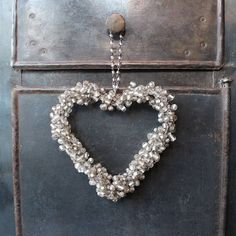 a heart shaped decoration hanging from a door