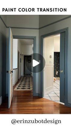 an empty hallway with blue walls and white trim on the door, and wood flooring