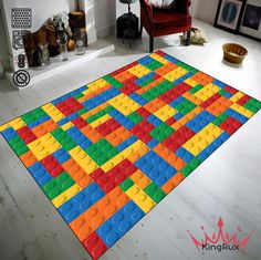 a large rug made out of legos in a living room with a chair and fireplace