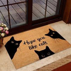 a door mat with two black cats on it and the words hope you like cats