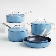 blue pots and pans on white background