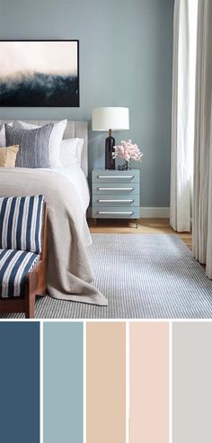 a bedroom with blue walls and white furniture