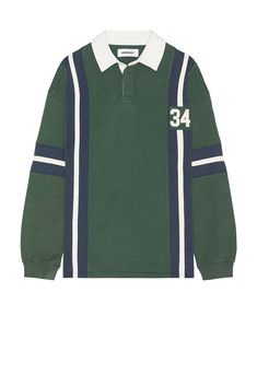 a green and white sweater with the number 34 on it