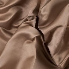 Create your own red carpet look with this Double Faced Duchesse Satin. Luminous with an incredibly smooth hand, this duchesse satin showcases pure luxury. Thicker with a medium weight, it has a full drape that is perfect for A-line gowns. Its stiffness creates a durability perfect for beading and sequins. Opaque, a lining is optional depending on its application. This collection features six color ways, so you are sure to find the perfect color for you! Classic Satin Dress For Party, Formal Solid Color Satin Dress, Formal Silk Satin Dress, Solid Color Silk Satin Dress, Classic Silk Satin Formal Dress, Classic Silk Satin Dress For Formal Occasions, Satin Wedding Dress With Silk Lining, Wedding Satin Dress With Silk Lining, Red Carpet Look