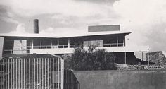 an old black and white photo of a house