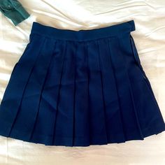 Wesleyny Navy Blue Pleated Skirt, High Waisted, Never Worn High Waist Pleated Preppy Skirt, Preppy High-waisted Pleated Skirt, Blue School Uniform Pleated Skirt, Navy Casual Tennis Skirt, Navy Pleated Skort, Blue Pleated Skirt For School, Blue Pleated School Uniform Skirt, Blue Mini Length Skirt For School, School Uniform Pleated Mini Skirt