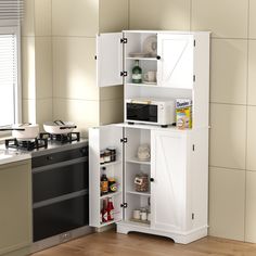 an open cabinet in the corner of a kitchen