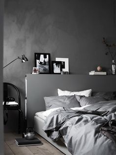 an instagram page with black and white pictures on the wall, bedding and pillows