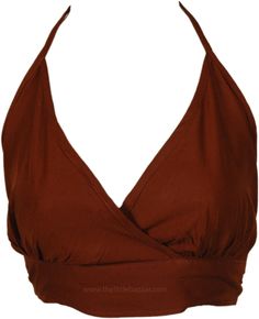 A single soft solid-colored halter neck bralette has straps that come up from the sides of the bralette that extend behind the neck, creating a halter-style neckline. Additionally, it has another tie at the back to secure the bralette in place. #tlb #Sleeveless #beachwrap #bohemianfashion #Handmade #BohemianTop Summer Halter Top With Crisscross Straps And Cross Back, Solid Halter Neck Swimwear With Crisscross Straps, Bra Friendly Strappy Halter Top For Vacation, Strappy Bra Friendly Halter Top For Vacation, Summer Bra Friendly Backless Halter Top, Vacation Bra Friendly Strappy Halter Top, Chic Halter Neck Crop Top With Adjustable Straps, Summer Crop Top With Strappy Back And Bra Support, Summer Crop Top With Strappy Back And Bra Friendly