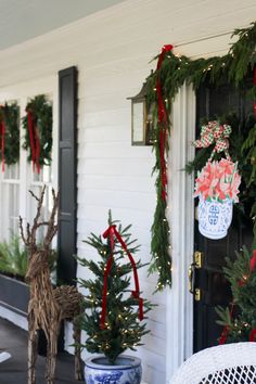 christmas decorations on the front porch of a house