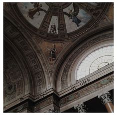 an ornate ceiling with paintings on it