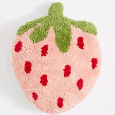 a close up of a stuffed strawberry on a white background