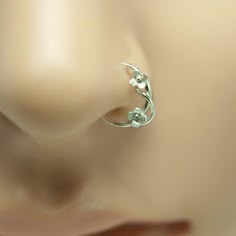 a close up view of an earring on a mannequin's head