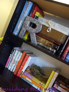 the bookshelf is filled with many different types of books, including letter r