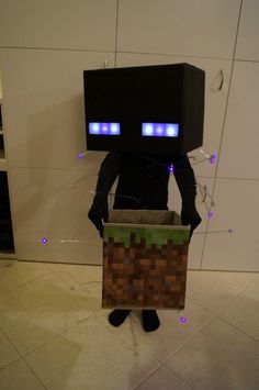 an image of a man that is dressed up as a minecraft creeper with glowing eyes