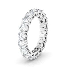 Rockstar radiance, round and round. This HauteCarat diamond eternity band beams a luminous ring of light from round-cut lab diamonds. Luminous Ring, Round Eternity Band, Round Diamond Eternity Band, Stackable Wedding Bands, Eternity Rings, Sterling Silver Wedding Band, Diamond Eternity Band, Silver Wedding Bands, Moissanite Wedding Rings