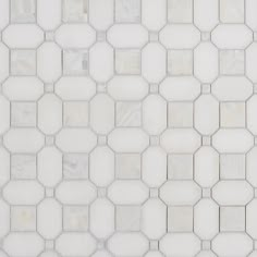 a white tiled wall with hexagonal tiles