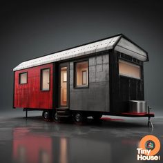 a tiny red and black house on wheels