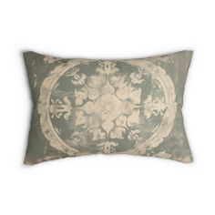 a decorative pillow on a white background with an old - fashioned design in the center