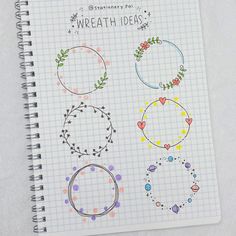 a spiral notebook with some drawings on it