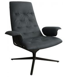 an office chair with black leather upholstered on the back and footrests