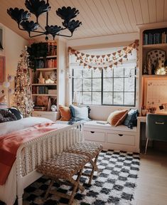 a bedroom decorated for christmas with lots of holiday decorations on the windowsill and shelves