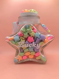 a star shaped bottle filled with colorful candies