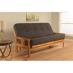 a wooden futon bed frame in a living room