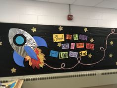 a bulletin board with a rocket ship on it