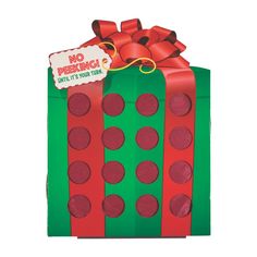 a green and red gift box with polka dots