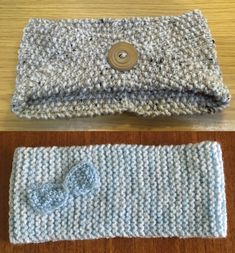 two knitted items sitting on top of a wooden table, one with a button and the other without