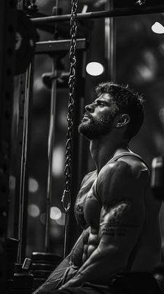 a man sitting in the middle of a gym