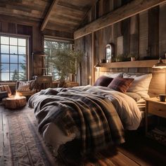 a bedroom with wooden walls and flooring has a large bed covered in plaid blankets