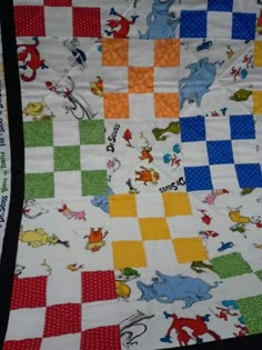 a colorful quilt with animals on it