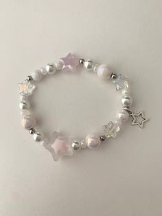 A pastel pink glass bead and pearl elastic bracelet with star elements  *bracelet is kids sized or meant for smaller wrists Coquette Diy, Stars Bracelet, Pink Star, Star Bracelet, Bracelet Diy, Pink Stars, Elastic Bracelet, Bracelet Ideas, Pink Glass