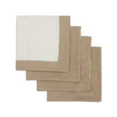 four pieces of linen folded in beige and white