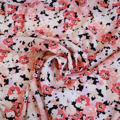 a pink and black floral print fabric