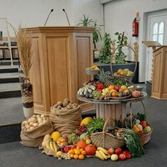 three tiered trays filled with different types of fruits and vegetables