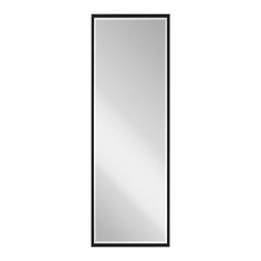 a black framed mirror on a white wall