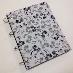 an open notebook with mickey mouses on it